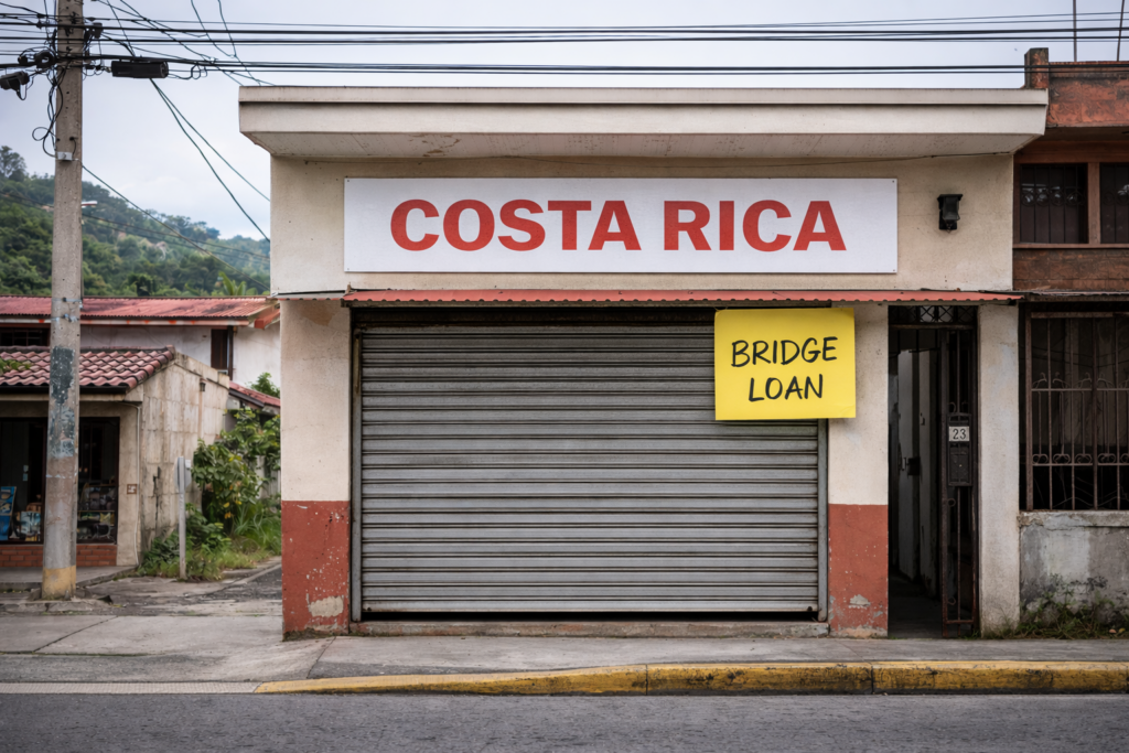 Small Costa Rican storefront with metal shutter and bridge loan sign