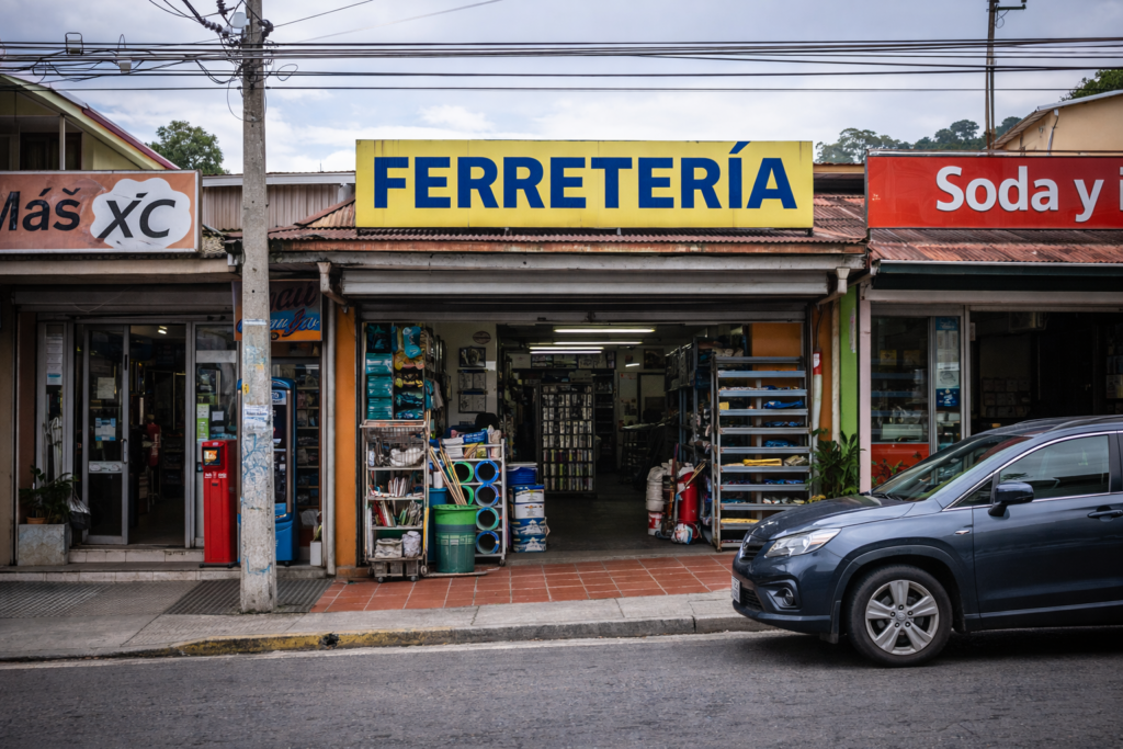 Small Costa Rican commercial strip with ferretería storefront